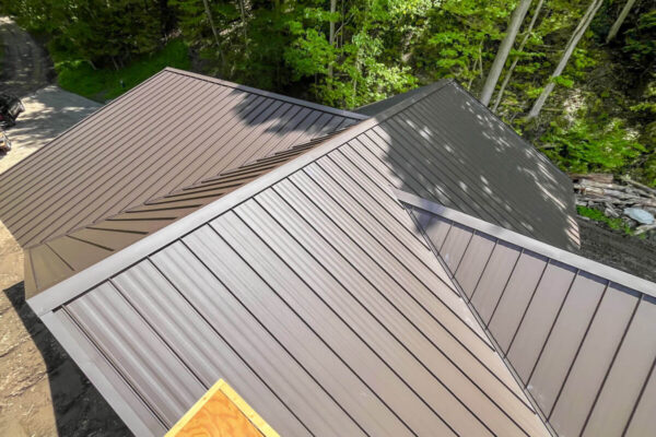 Custom residential metal roofing angles and expert ridge installation.